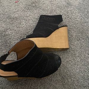 This Cute pair of black wedge heels